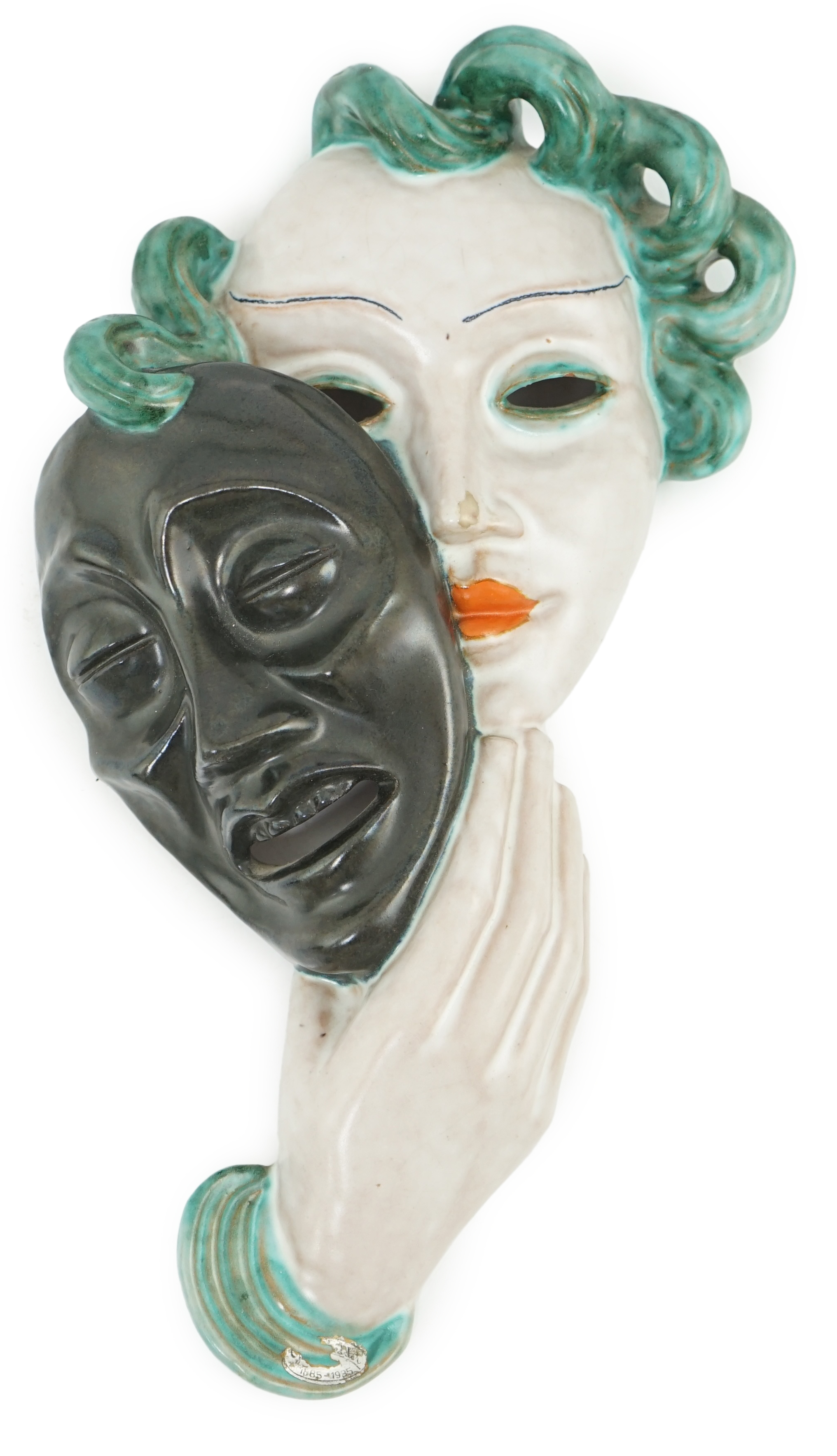 An Art Deco tin-glazed terracotta theatrical wall mask, by Goldscheider